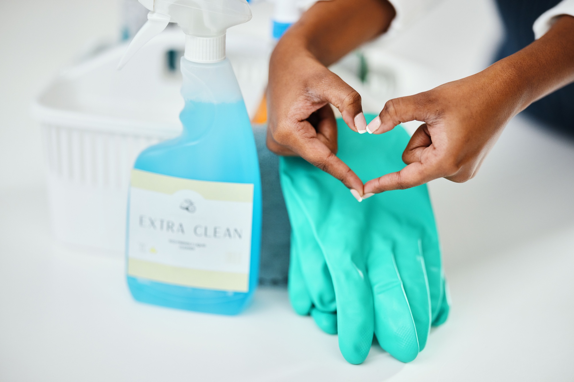 Heart hands, cleaning and chemical detergent bottle, closeup of supplies and cleaner with hygiene.